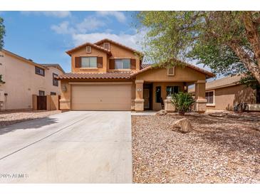 Inviting two-story home with a neutral palette, desert landscaping, covered porch, and a two-car garage at 136 W Brahman Blvd, San Tan Valley, AZ 85143