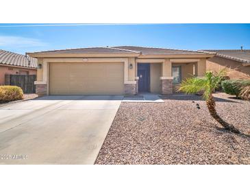 Charming single-story home featuring a two-car garage, low-maintenance landscaping, and a neutral color palette at 16887 W Belleview St, Goodyear, AZ 85338