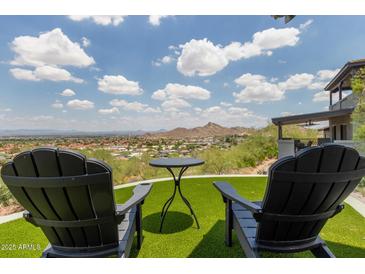 Inviting patio with Adirondack chairs and stunning city views at 1701 E Camino Del Santo --, Phoenix, AZ 85022