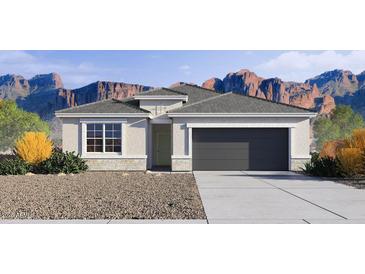 Charming single-story home featuring a two-car garage, neutral color palette and manicured landscaping at 24052 W Pima St, Buckeye, AZ 85326