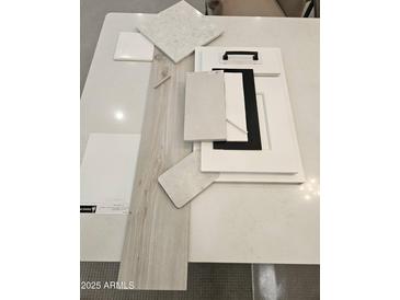 Selection of tile, flooring and cabinet samples with modern finishes and textures at 2508 E Preston St, Mesa, AZ 85213