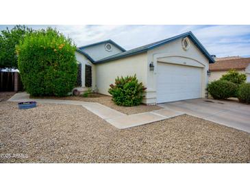 Charming single-story home featuring a well-maintained front yard and a two-car garage at 11022 N 60Th Dr, Glendale, AZ 85304