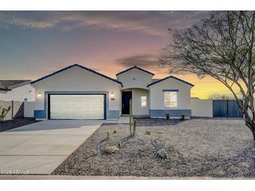 Charming single-story home featuring desert landscaping and a spacious two-car garage at 14178 S Diablo Rd, Arizona City, AZ 85123
