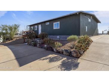 Charming single-story home features a well-manicured yard and a welcoming entrance at 13020 N 18Th St, Phoenix, AZ 85022