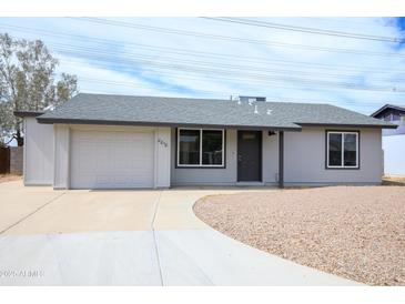 Charming single story home featuring a neutral color palette, new roof, and low maintenance front yard at 2018 W Western Dr, Chandler, AZ 85224