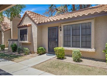 Inviting single-story home featuring a terra cotta roof and a well-maintained, drought-resistant landscaped front yard at 3491 N Arizona Ave # 174, Chandler, AZ 85225