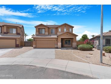 Charming two-story home featuring desert landscaping and a two-car garage at 36265 W Alhambra St, Maricopa, AZ 85138