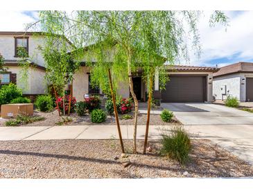 Charming home featuring a desert landscape with colorful bougainvillea and a neutral color scheme at 3053 W Straight Arrow Ln, Phoenix, AZ 85083