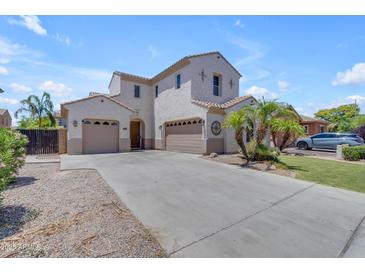 Inviting two-story home featuring a three-car garage and manicured landscaping at 6840 S Crystal Way, Chandler, AZ 85249