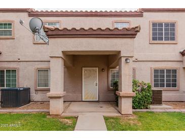 Inviting entrance with covered porch and well-maintained landscaping at 125 S 56Th St # 124, Mesa, AZ 85206