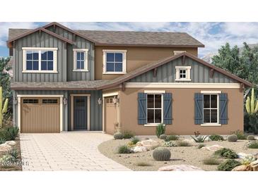 Charming two-story home with a well-maintained desert landscape, offering curb appeal and a welcoming atmosphere at 2014 W Rowel Rd, Phoenix, AZ 85085