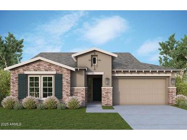 Beautiful single-story home with stylish stone accents, two-car garage, and well-maintained landscaping at 21599 W Pierson St, Buckeye, AZ 85396