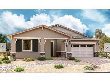 Charming single-story home with a neutral color palette, well-manicured landscaping, and a two-car garage at 21854 E Bonanza Ct, Queen Creek, AZ 85142