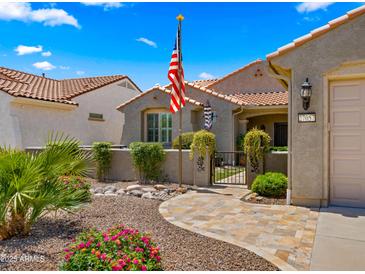 Charming single-story home featuring a tile roof, desert landscaping, and inviting curb appeal at 27057 W Tonopah Dr, Buckeye, AZ 85396