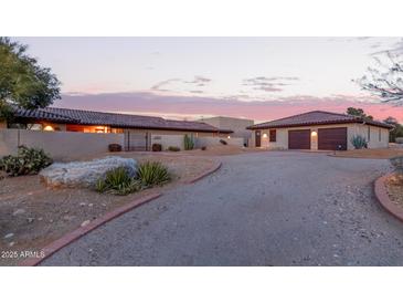 Charming desert home with tile roof, private drive and desert landscaping at 36801 N Long Rifle Rd, Carefree, AZ 85377