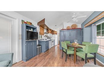 Bright eat-in kitchen features wood floors, ample cabinet space, and modern appliances at 838 Aquamarine Dr, Apache Junction, AZ 85119