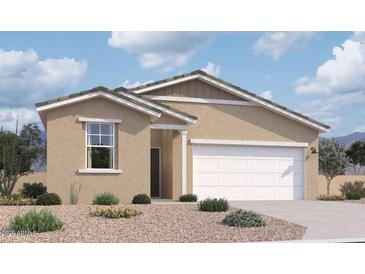 Tan single-story home featuring a two-car garage, desert landscaping, and a welcoming front entrance at 47705 W Moeller Rd, Maricopa, AZ 85139
