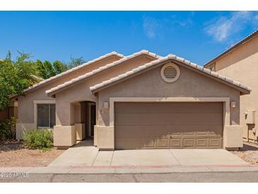 Charming single-story home with a well-maintained yard and a welcoming facade at 125 N 22Nd Pl # 53, Mesa, AZ 85213