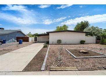 Charming single story home featuring a front yard with desert landscaping at 1939 E Alameda Dr, Tempe, AZ 85282