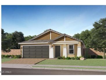 Charming single-story home featuring a two-car garage, neutral paint, and well-manicured landscaping at 5064 S 234Th Ave, Buckeye, AZ 85326