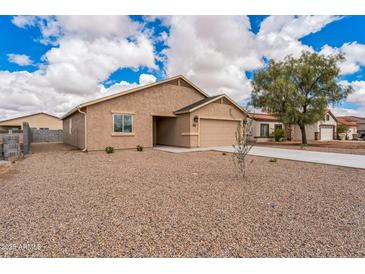 Inviting single-Gathering home featuring desert landscaping, a two car garage, and a classic design at 15120 S Amado Blvd, Arizona City, AZ 85123