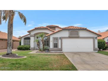 Charming single-Gathering home with a well-maintained lawn and a classic white exterior in a serene neighborhood at 6915 E Lakeview Ave, Mesa, AZ 85209