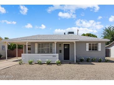 Charming single-story home with a well-maintained front yard and covered entry at 2223 E Roma Ave, Phoenix, AZ 85016