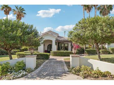 Charming home featuring manicured landscaping, a brick walkway, and a welcoming front entrance at 1330 N 40Th St # 1, Mesa, AZ 85205