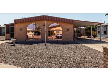 Charming single-story home with covered parking and easy-care gravel landscaping at 5221 E Mills Ct, Mesa, AZ 85215