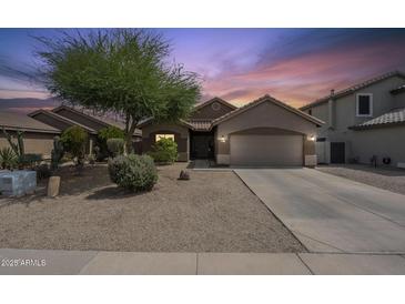 Charming single-story home showcasing desert landscaping and a spacious two-car garage at 7937 W Chickasaw St, Phoenix, AZ 85043