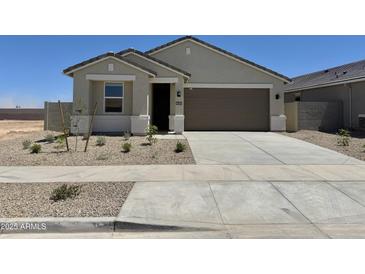Charming single-story home featuring a two-car garage and low-maintenance landscaping in a sunny setting at 46484 W Lander Ln, Maricopa, AZ 85139