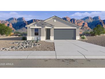 Charming single-story home featuring a neutral color palette and low-maintenance desert landscaping, set against a scenic mountain backdrop at 46484 W Lander Ln, Maricopa, AZ 85139