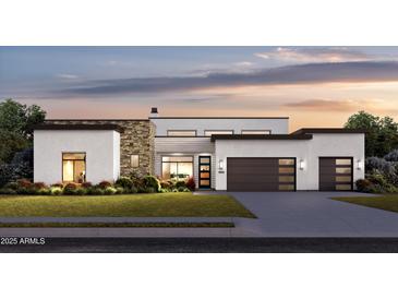 Modern home featuring stone accents, a two-car garage, and beautiful landscaping at 8300 E Dixileta Dr # 306, Scottsdale, AZ 85266