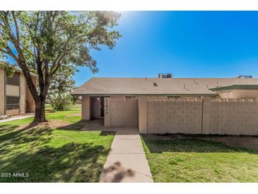 Inviting single-story home featuring a well-maintained lawn and cozy entrance at 17830 N 45Th Ave, Glendale, AZ 85308