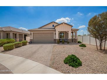 Beautiful single-story home featuring a neutral color palette, paver driveway, and low maintenance desert landscaping at 6550 S 24Th Pl, Phoenix, AZ 85042