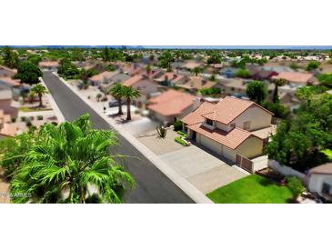 Charming single-Gathering home in a quiet neighborhood with mature landscaping and a tile roof at 7625 W Dreyfus Dr, Peoria, AZ 85381