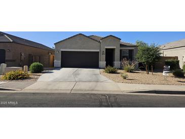 Attractive single-story home with a well-maintained front yard and a two-car garage at 1246 E Thomas Dr, Casa Grande, AZ 85122