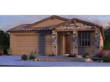 Charming single-story home with stone accents, a tile roof, and a two-car garage in a desert landscape at 10859 E Tillman Ave, Mesa, AZ 85212