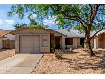 Charming single-story home featuring a low-maintenance desert landscape and a two-car garage at 1926 E Sandra Ter, Phoenix, AZ 85022