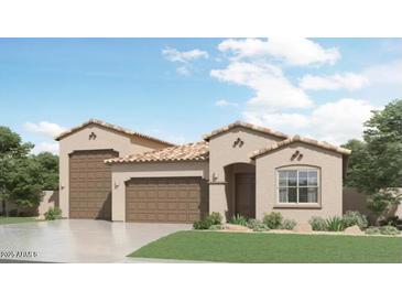 Inviting single-story home showcasing a spacious three-car garage and beautiful desert landscaping at 32452 N Cherry St, San Tan Valley, AZ 85143