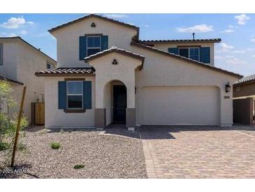Charming home with a two-car garage and low maintenance landscaping at 32499 N 122Nd Ave, Peoria, AZ 85383