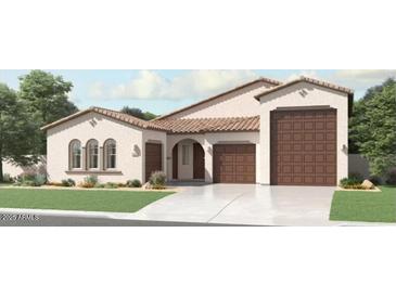 Charming single-story home featuring a tile roof, a three-car garage, and a well-manicured front lawn at 3858 E Kenley Ln, San Tan Valley, AZ 85143