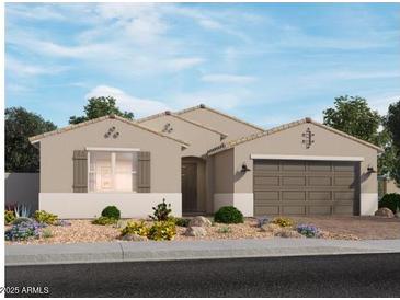 Charming single-story home with desert landscaping and a two-car garage at 15915 W El Cortez Pl, Surprise, AZ 85387