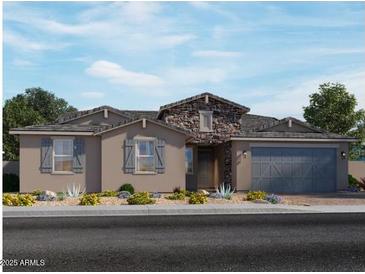 Charming single-story home with stone accents, a well-maintained yard, and a two-car garage at 15933 W El Cortez Pl, Surprise, AZ 85387