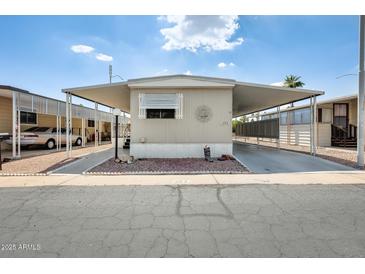 Charming single-story home with covered parking and low-maintenance landscaping at 205 S Higley Rd # 293, Mesa, AZ 85206