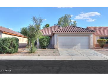 Charming single-story home featuring a well-maintained yard and a two-car garage at 537 W Kingman Dr, Casa Grande, AZ 85122