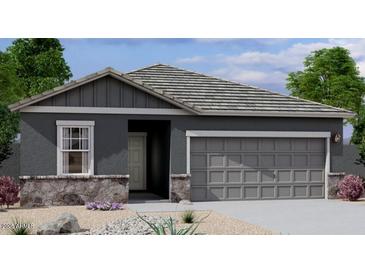 Charming single-story home featuring a two-car garage, stone accents, and neutral color scheme at 6041 E Artemis Dr, Florence, AZ 85132