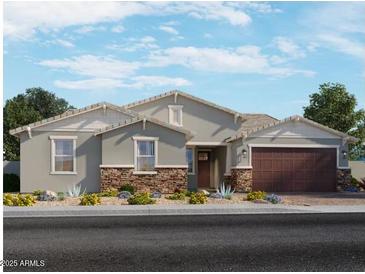 Charming single-story home with stone accents, a neutral palette, and a well-manicured front yard at 15952 W El Cortez Pl, Surprise, AZ 85387