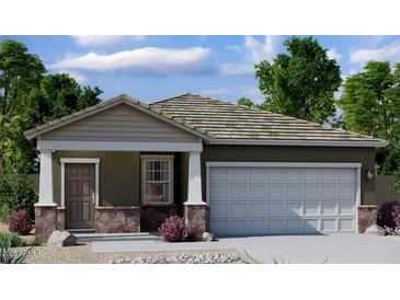 Charming single-story home with a two-car garage and stone accents, perfect for modern living at 29665 N Oak Dr, Florence, AZ 85132