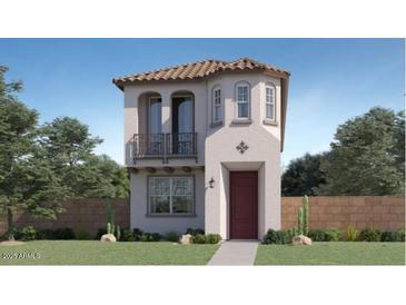 Charming two-story home with stucco exterior, tiled roof, balcony, and desert landscaping at 3339 S Lily Ave, Mesa, AZ 85212
